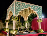 Decorative green floral corner mirror panels with elegant peacock and vine mirror artwork for wedding décor and luxury wall styling.
