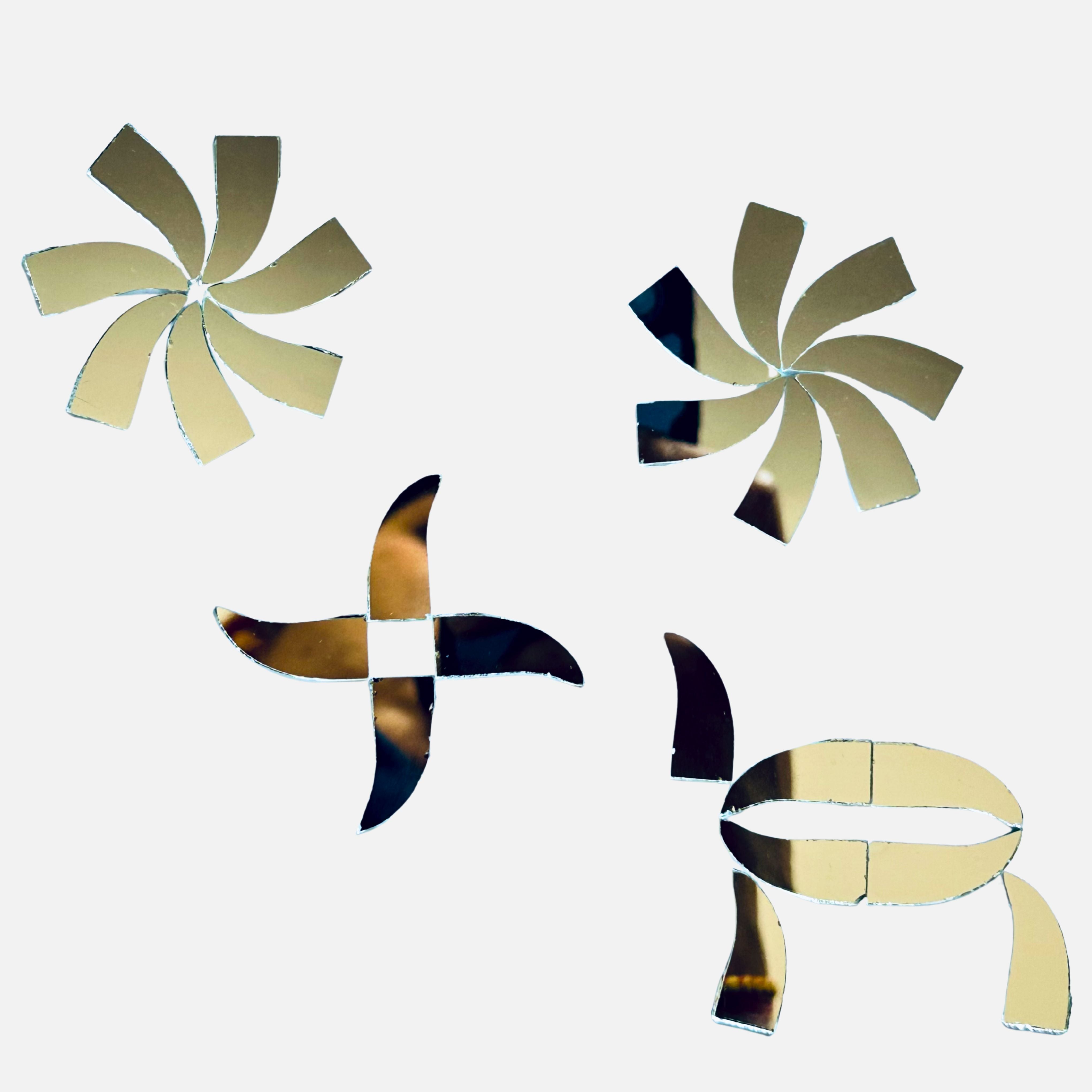 Mixed petal and curved shape silver mirror pieces arranged in floral patterns, perfect for Lippan art, mirror work, and creative DIY wall décor designs.