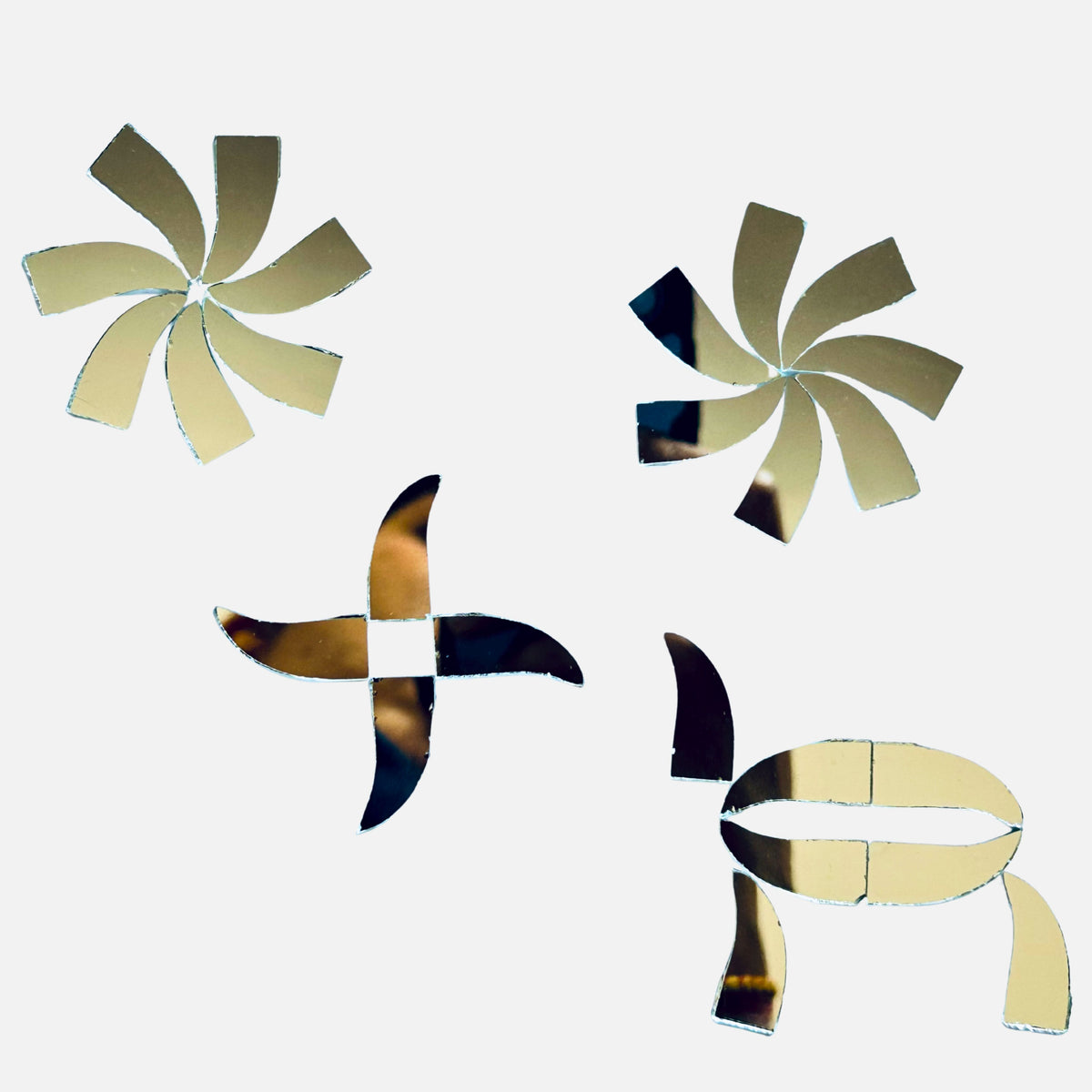 Mixed petal and curved shape silver mirror pieces arranged in floral patterns, perfect for Lippan art, mirror work, and creative DIY wall décor designs.