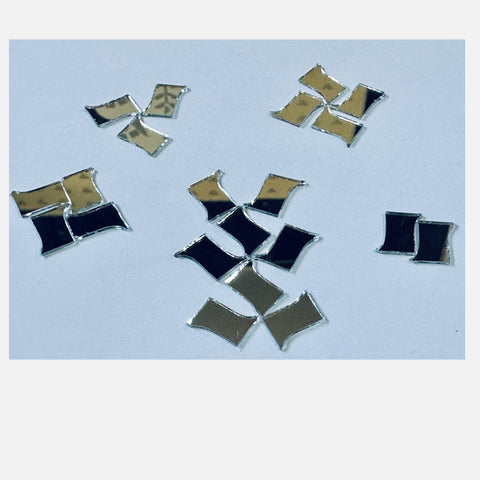 Curved square petal shape silver mirror pieces arranged in floral patterns, perfect for Lippan art, mirror work, and DIY wall décor designs.